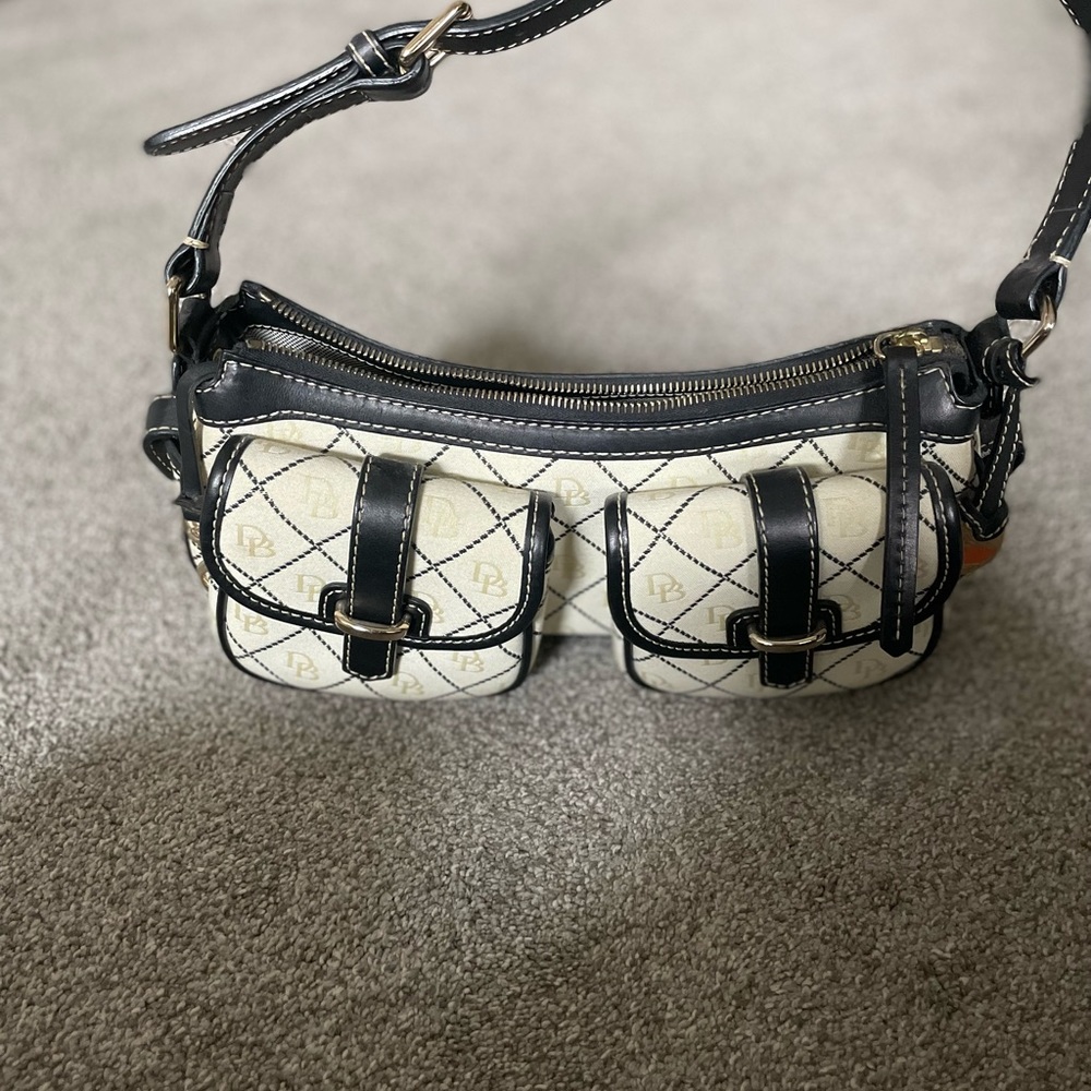 Dooney and Bourke handbag. Off-white with leather detail.